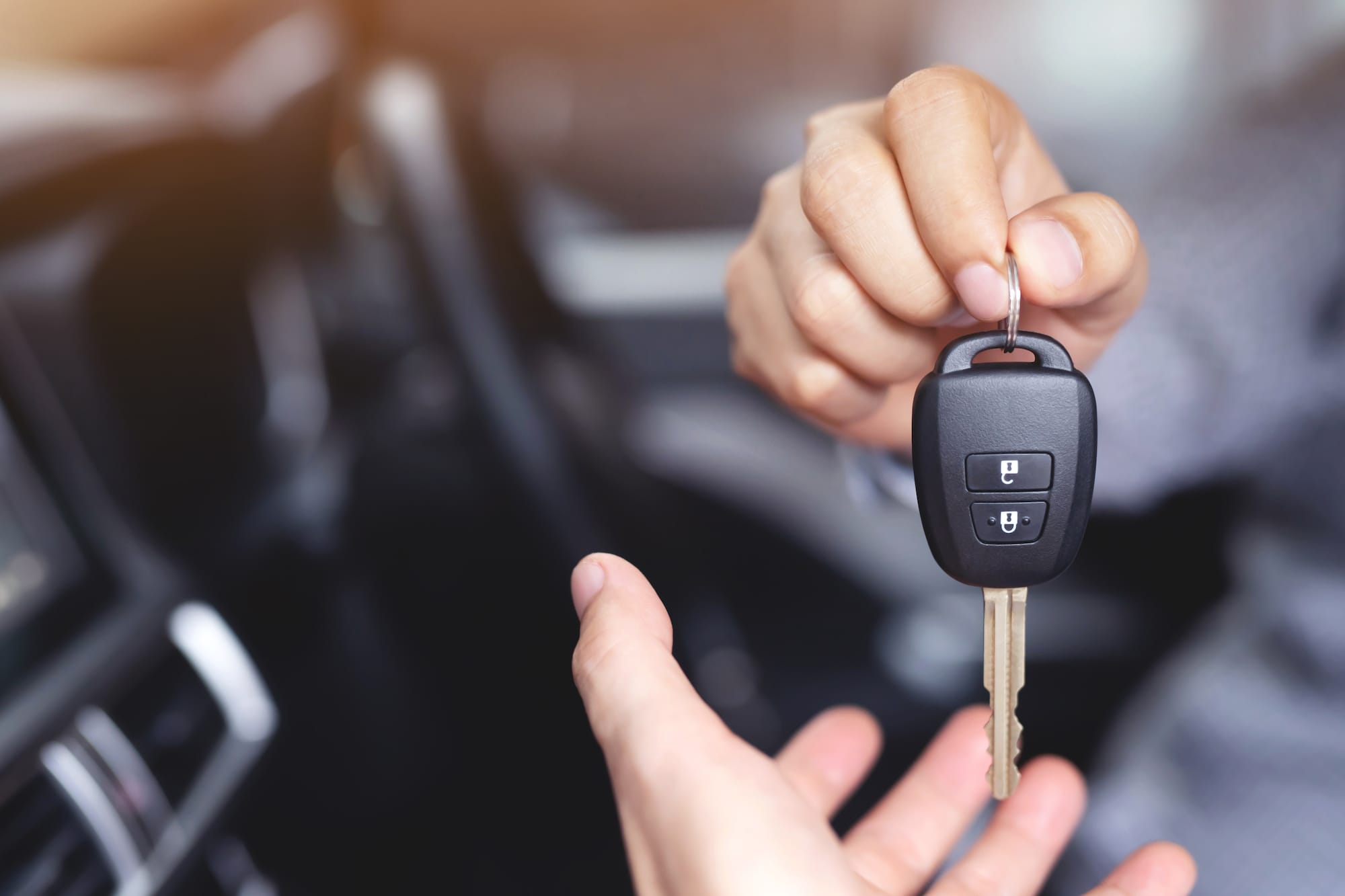Person donating their car and handing over the keys
